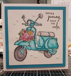 a handmade card with a blue scooter and flowers on the front that says, life is a journey enjoy the ride