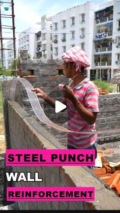 a man in pink and white shirt standing next to brick wall with text overlay that reads steel punch wall reinforcement