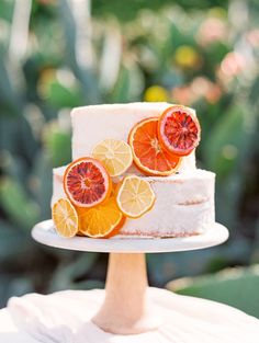 a white cake with orange slices on top