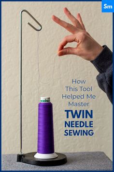 a person is holding their hand over a thread spool with the words how this tool helped me master twin needle sewing