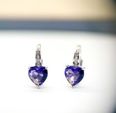 Sweet heart earrings! Deep purple amethyst heart shaped Cubic Zirconia gemstone! 3 prong setting 5mmx6mm size Drop length 15mm February birthstone Perfect gift for someone you love!  Thanks for looking make sure to check out my store for other unique gift ideas! https://www.etsy.com/ca/shop/PersonalizedByLD Lisa Heart Cut Diamond Earrings With Prong Setting As Gift, Heart-shaped Sterling Silver Diamond Earrings For Gift, Heart-shaped White Gold Gemstone Earrings, White Gold Heart Earrings With Gemstones, White Gold Heart Gemstone Earrings, White Gold Heart Shaped Gemstone Earrings, Cubic Zirconia Heart Dangle Earrings For Gift, Heart Cut Earrings With Prong Setting As Gift, White Gold Heart-shaped Birthstone Earrings