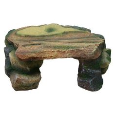 a small bench made out of rocks on a white background