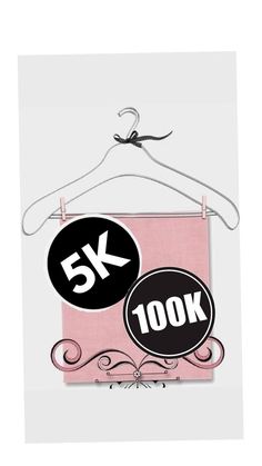 a pink and black sign hanging from a white hanger with the words 5k on it