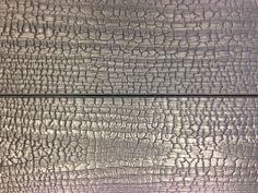 an image of wood textured in silver and white colors with black lines on it