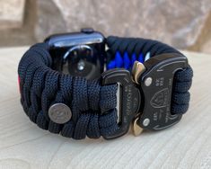 "FREE USPS PRIORITY MAIL SHIPPING FOR DOMESTIC US ORDERS (Includes U.S. Military APO/FPO Address Overseas) Thank you for visiting our shop \"Cording 2U\". A veteran owned business. Handcrafted Paracord wearables customized \"According To You\". Handcrafted with 100% Nylon Paracord \"MADE IN USA\" Our Products include: 🔹Custom handcrafted watch bands according to your wrist size, style, and color of choice. If you don't see it in our page yet, please contact us and we can discuss your options. ? Custom Black Watch Accessories For Gift, Custom Black Watch Accessories As Gift, Durable Black Watch Bands For Customization, Black Watch Bands With Bracelet Strap For Customization, Durable Adjustable Outdoor Watch Bands, Durable Outdoor Functional Watch Bands, Custom Black Apple Watch Band With Bracelet Strap, Black Paracord Watch Accessories For Outdoor, Black Paracord Bracelet Strap Watch Band