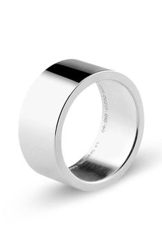 This essential sterling silver band ring with a wide design and minimal style adds dapper shine to your look. Sterling silver Made in France Modern White Gold Wide Band Ring In Sterling Silver, Modern Wide Band Ring In White Gold Sterling Silver, Minimalist Sterling Silver Wide Band Ring For Formal Events, Minimalist Sterling Silver Wide Band Ring For Formal Occasions, Modern White Gold Wide Band Ring For Gift, Modern White Gold Wide Band Ring Gift, Modern White Gold Wide Band Ring As Gift, Minimalist Silver Wide Band Ring With Polished Finish, Modern Wide Band Ring With Polished Edges