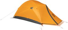 an orange tent sitting on top of a white floor