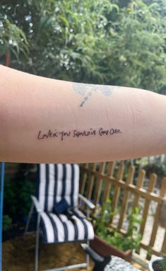 a person with a tattoo on their arm that says, let't you surprise give one