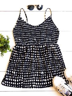 Cute, simple, and stylish... need we say more. The smocked top, beautiful pattern, and soft fabric make this tank stand out in a crowd. Note: Smocking is only on the front of the tank. The back is solid. Size Small 0-4 Medium 6-8 Large 10-12 XL 12-14 Casual Smocked Bodice Camisole Tank Top, Casual Camisole Tank Top With Smocked Bodice, Casual Spring Tank Top With Smocked Back, Chic Beach Tank Top With Smocked Bodice, Beach Cami Tank Top With Smocked Bodice, Cami Tank Top With Smocked Bodice For Beach, Smocked Back Cami Tank Top For Day Out, Chic Vacation Tank Top With Smocked Back, Chic Tank Top With Smocked Back For Vacation