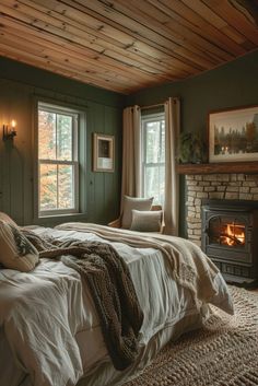 a bedroom with a bed and fireplace in it