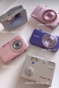 four different types of digital cameras sitting next to each other