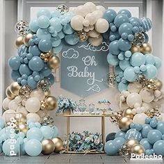 a blue and gold baby shower with balloons