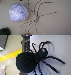 a spider made out of plastic sitting on top of a desk