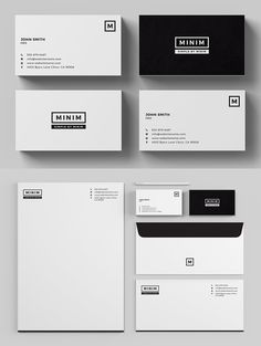 some business cards and envelopes on a gray background