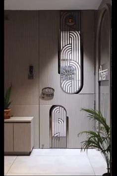 an art deco bathroom is shown with mirrors on the wall and plants in pots next to it