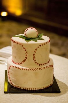 a baseball themed wedding cake on a table