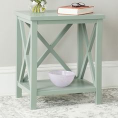 a small table with a bowl and book on it