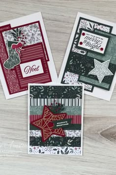 three christmas cards on a table with one being folded and the other has a star