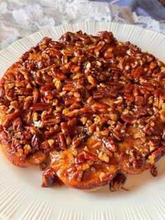 two pieces of pecan bread on a white plate