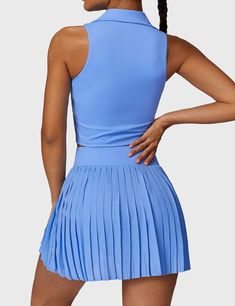 This 2-piece tennis skirt set features a V-neck polo top and a high-waisted pleated skirt for a sporty, cute look. Crafted from ultra-soft, breathable fabric, it offers comfort and freedom of movement, complete with built-in shorts for coverage. Perfect for tennis, golf, or casual wear—add both pieces to your cart to complete the look!   Feature   Top:   V-neck polo collar   Sleeveless design   Removable cup pads   Skirt:    High waisted waistband   Irregular pleated hem   Built-in shorts   Inne High Waisted Pleated Skirt, Sport Bra Top, Polo Top, Skirt Sets, Collar Top, V Cuts, Tennis Skirt, Top Sales, Polo Collar