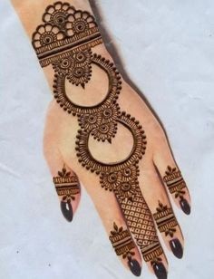 a henna design on the palm of someone's hand