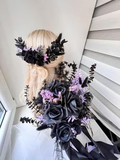 a woman with long blonde hair and flowers in her hair