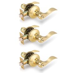 two golden door handles with decorative knobs