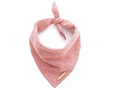 a pink bandana with a gold bar on the front and bottom, tied to a white background