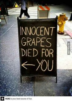 a sign that says innocent grapes died for you