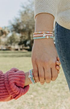 Lighten up your spring look with our Pastel Spring Bracelet Set! This 3-bracelet set comes in both adult and mini sizes, featuring delicate pastel colors, whimsical pearl bead detailing, and 18k gold beads. Perfect for Easter or a fresh addition to your jewelry collection! Spring Friendship Bracelets For Everyday Wear, Spring Beaded Bracelets For Everyday, Spring Everyday Friendship Bracelets, Spring Everyday Beaded Bracelets, Playful Beaded Bracelets As Spring Gifts, Playful Beaded Bracelets For Spring, Playful Beaded Bracelets For Friendship In Spring, Spring Friendship Bracelets With Letter Beads As Gifts, Everyday Beaded Bracelets For Spring