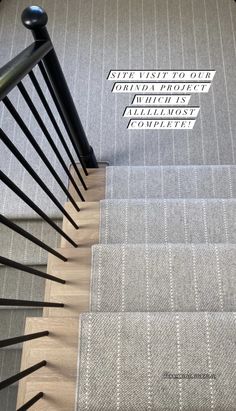 some stairs with signs on them and carpet