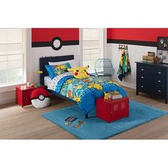 a child's bedroom with pokemon bedding and furniture