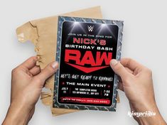 two hands holding up a card for a birthday bash with the word raw on it