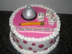 a birthday cake decorated with dice and other items