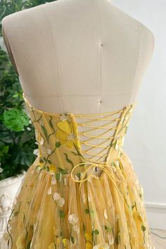 Indulge in pure luxury with our Strapless Corset Yellow Floral Embroidered Midi Dress. Adorned with delicate floral embroidery, this dress is perfect for special occasions or nights out. The strapless design adds a touch of sophistication, while the corset detail creates a flattering silhouette. Elevate your wardrobe and make a statement with this exquisite piece. Bust and Skirt with full lining. 100% Polyester 100% Recycled polyester lining Concealed zip at centre back Imported Yellow Corset Dress, 2024 Lookbook, Floral Floor, Floral Pattern Dress, Lavender Floral, Embroidered Midi Dress, Floral Print Chiffon, Strapless Corset, Fabric Accessories