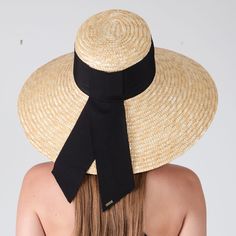 Natural straw UPF 50+ protection sunhat available in a Black grosgrain band and an Ivory grosgrain band. UPF 50+ protection Includes discreet adjustable grosgrain on inside crown for desired fit. From the Eugenia Kim Core Collection. 6.75" X 4" X 6.25" Adjustable Black Boater Hat With Upf 50+, Elegant Adjustable Straw Hat With Uv Protection, Black Brimmed Boater Hat With Upf 50+, Black Wide Brim Boater Hat With Upf 50+, Black Boater Hat With Upf 50+, Elegant Adjustable Panama Hat With Visor, Elegant Adjustable Panama Visor Hat, Black Toquilla Straw Sun Hat For Kentucky Derby, Chic Black Visor Sun Hat