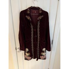 Elevate Your Wardrobe With This Johnny Was Velvet Coat Jacket, Featuring Intricate Embroidery And A Rich Burgundy Hue. Ideal For Adding A Touch Of Boho Elegance. Button Front Closure Two Front Pockets Floral Embroidery Velvet Material Bohemian Style Measurements Laying Flat: -Armpit To Armpit 19.5" -Length From The Shoulder 35.5" Excellent Preowned Condition Red Floral Embroidered Outerwear, Red Floral Embroidery Outerwear For Fall, Red Floral Embroidered Outerwear For Fall, Embroidered Long Sleeve Blazer For Fall, Embroidered Velvet, Rich Burgundy, Velvet Coat, Burgundy Floral, Intricate Embroidery