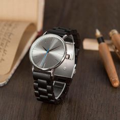 Engraved Watch, Wood Watch, Watch for Men, Groomsmen Watch, Unique Watch, Father's Day Gift, Custom Engraving, Gift for Him, Boyfriend Gift 🌟 Features and Qualities of Our Wood Watch with Metal Case & Wooden Band 🌟 Design & Craftsmanship ✋ Handmade Excellence: Each watch is handcrafted with passion and precision, making it a unique piece of art. 💎✨ 🎨 Personalized for You: Customize your watch with special engravings like dates, initials, or quotes. It's a gift straight from the heart! 💖📝 Wood Bezel + Stainless Steel Case: A perfect blend of natural wood's rustic charm and modern stainless steel's sleekness. 🌳🖤 Durability & Functionality 🌟 Luminous System: Glows in the dark so you can tell the time effortlessly at night. 🌌⏱️ 💎 Hardlex Mirror Material: Scratch-resistant and smudge Boyfriend Gift Birthday, Wooden Watch Engraved, Groomsmen Watches, Watch Wood, Father Birthday Gifts, Groomsmen Gift Set, Personalized Watch, Engraved Watch, Wooden Watches For Men