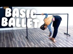 a woman doing a handstand in front of a black metal bar with the words basic ballet on it