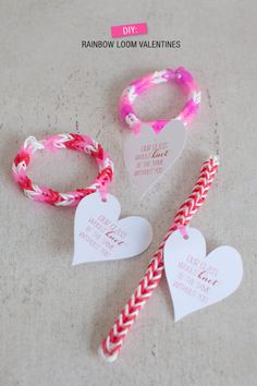 three valentine's day bracelets and two heart shaped candy canes