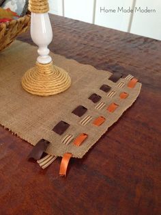 a table with a place mat and some utensils sitting on top of it