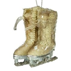 a snow boot ornament hanging from a chain