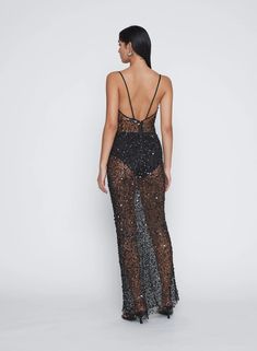 Heightened tactility and luminous surface is combined to form this sleeveless sequin maxi dress. Its elongating column silhouette is framed with fine satin straps. Artfully constructed from a sheer sequin netting that sculpts the body, hand beaded to catch the light from all angles. Due to the delicate nature of this dress; it is final sale. Sequin Maxi Dress, Sequin Maxi, Knitwear Tops, Black Sequins, Hand Beading, Holiday Dresses, Scoop Neckline, Occasion Dresses, Spaghetti Strap