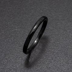 a black ring sitting on top of a table