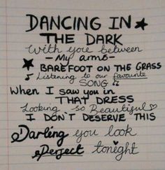 a handwritten poem on lined paper that says dancing in the dark with you between my feet