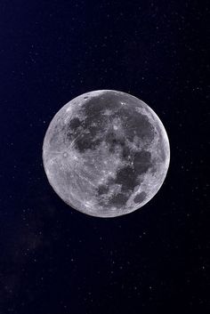 the full moon is visible in the night sky with stars on it's sides