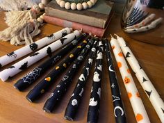 a collection of halloween themed candles on a table