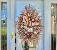 a front door with a wreath on it