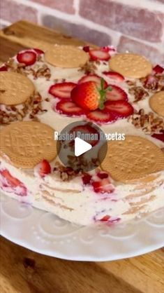 a cake with strawberries and cream on top is shown in this video screen graber