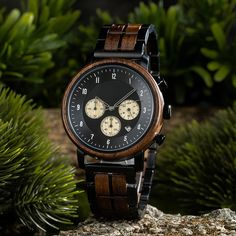 "Welcome to our Wooden Watch store, your go-to destination for personalized gifts, ideal for Father's Day and Mother's Day celebrations. Shipping Information: Due to high demand, our standard processing time is extended by 3 to 7 days. Expedite your order with Express Shipping for an additional $20. With DHL Express, expect delivery within 3-5 days worldwide. Thank you for your patience and trust. Engraving Information: Personalize your gift with free engravings on the watch and wooden box lid. Simply send us your desired engraving details, and within 24 hours, we'll provide a digital design for approval. Key Features: Classic walnut wood and silver chronograph combo. Free engraving for a personalized touch. Japanese Miyota mechanism for precise timekeeping. Adjustable strap for comfort. S Engraved Watches For Dad, Anniversary Present, Wooden Watch, Ebony Wood, Engraved Wood, Wristwatch Men, Wrist Watches, Wooden Box, Wood Watch